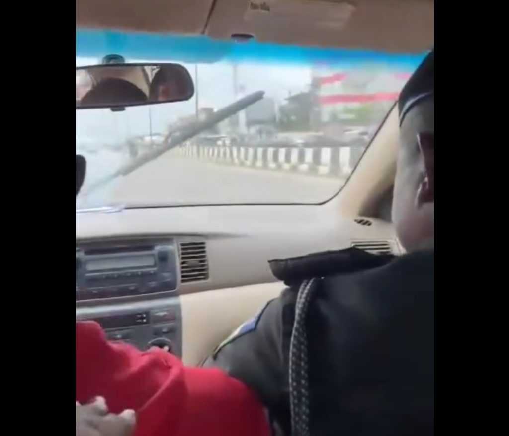 Nigerian Police Officer Engaging in Physical Altercation with Cab Driver as Female Passenger Pleads for Help 1 Screenshot 20240523 140849